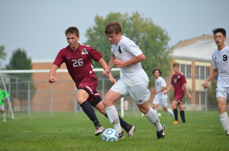 Senior Chase Spencer concentrates on moving the ball.