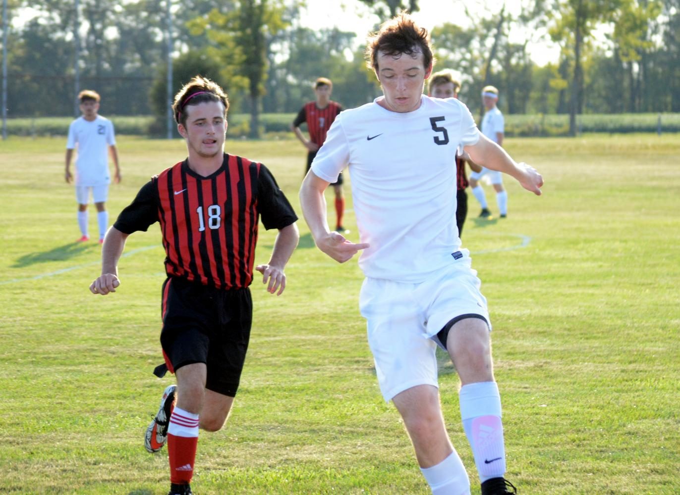Junior Luke Pierce tackles the ball against Edgewood in a victory.