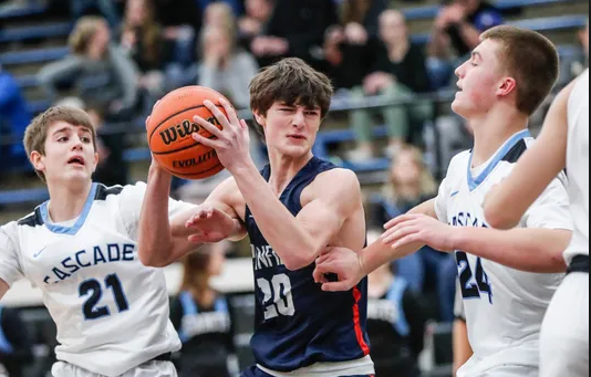 Sophomores Cole Spencer (21) and Dane DuBois on defense.