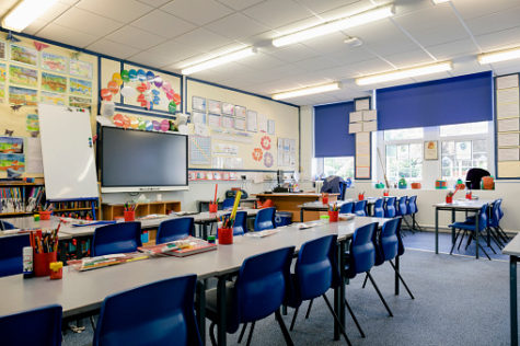 A wide angle view of an organised and tidy classroom in a school in Hexham in the North East of England